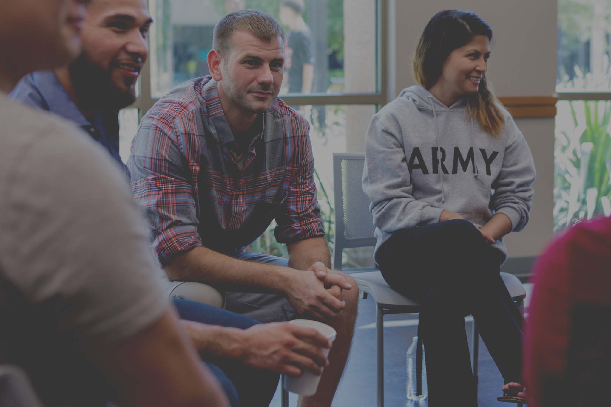 Diverse military veterans in group therapy
